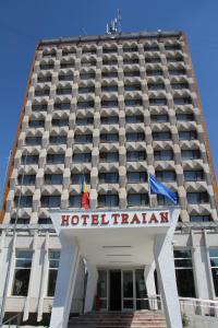 a hotel building with flags in front of it at Hotel Traian in Brăila