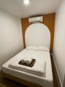 Postel nebo postele na pokoji v ubytování PI House Chiangkhan