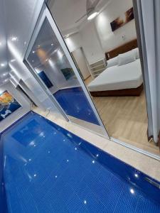 a view of a room with a bed and a swimming pool at Piscine privative et prestations haut de gamme in Dakar