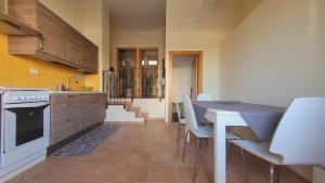 a kitchen with a table and chairs in a room at Casa Cinzia in Vieste