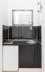 Kuchyňa alebo kuchynka v ubytovaní Apartment Entre les jardins