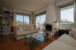 a living room with a couch and a fireplace at L’Attico di Susanna in Verbania