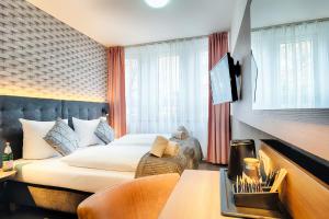 Postel nebo postele na pokoji v ubytování Home Hotel