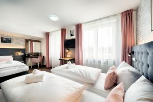 Postel nebo postele na pokoji v ubytování Home Hotel