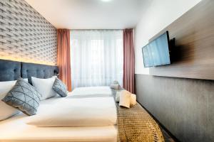 Postel nebo postele na pokoji v ubytování Home Hotel