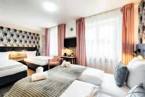 Postel nebo postele na pokoji v ubytování Home Hotel