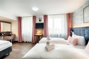 Postel nebo postele na pokoji v ubytování Home Hotel