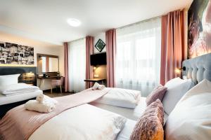 Postel nebo postele na pokoji v ubytování Home Hotel