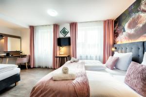 Postel nebo postele na pokoji v ubytování Home Hotel