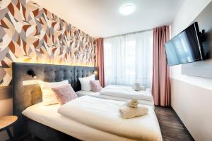 Postel nebo postele na pokoji v ubytování Home Hotel