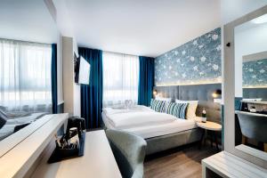 Postel nebo postele na pokoji v ubytování Home Hotel