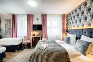 Postel nebo postele na pokoji v ubytování Home Hotel