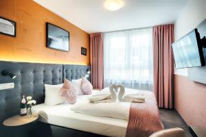 Postel nebo postele na pokoji v ubytování Home Hotel