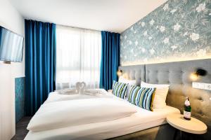 Postel nebo postele na pokoji v ubytování Home Hotel