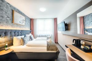 Postel nebo postele na pokoji v ubytování Home Hotel
