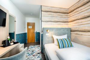 Postel nebo postele na pokoji v ubytování Home Hotel