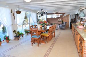 a dining room with a table and chairs at Cortijo Los Santeros in Castril
