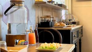 a kitchen with a counter with a table with a blender at Heritage Collection Palermo B&B in Palermo