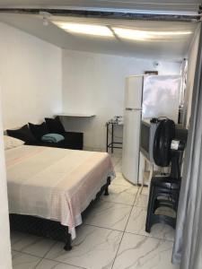 En eller flere senge i et værelse på Arraial suíte