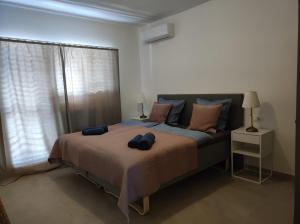 a bedroom with a bed with two towels on it at Penthouse apartment in Gornji Karin near the beach in Anić