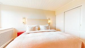 Ein Bett oder Betten in einem Zimmer der Unterkunft Ruarklef