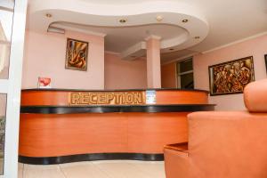 a lobby with a reception desk in a hospital at Nobilis Senior Suite a very good choice for a great vacational experience in Kigali