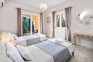 Ένα ή περισσότερα κρεβάτια σε δωμάτιο στο Villa Agni-Stefania +27 φωτογραφίες