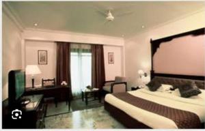 Ліжко або ліжка в номері Mansingh Palace, Ajmer