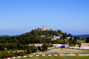 a castle on the top of a hill at Adenauer Forst Ring Apartment in Adenau