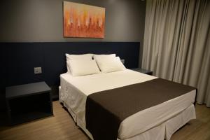 Postel nebo postele na pokoji v ubytování Carlton Plaza Hotel Uberlandia
