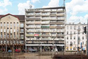 an apartment building in the middle of a city at Praga Targowa Modern Studio in Warsaw