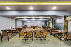 a large dining room with tables and chairs at Krushnai Resort in Lonavala
