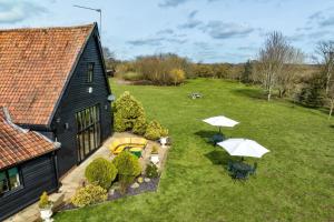 an aerial view of a yard with a house at Doves Barn in Needham Market