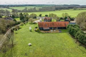 an aerial view of a house in a field at Doves Barn in Needham Market
