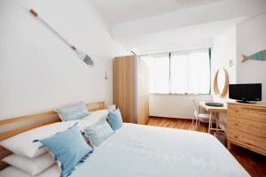 Ένα ή περισσότερα κρεβάτια σε δωμάτιο στο iDream Apartment & Rooms