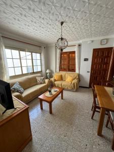 a living room with a couch and a table at Casa Pepa in Puerto de Mogán