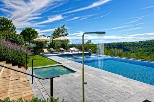an image of a swimming pool in a house at Villa Amagioia by Palazzo di Varignana in Varignana