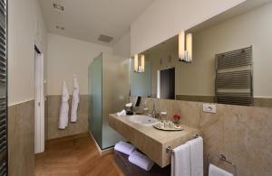 a bathroom with a sink and a mirror at Villa Amagioia by Palazzo di Varignana in Varignana +26 photos