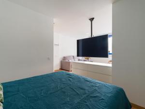 Televízia a/alebo spoločenská miestnosť v ubytovaní Suites Garden Apartamento 13