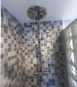 a shower with a shower head in a bathroom at Villa Marisol in Calpe