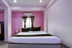 Postel nebo postele na pokoji v ubytování OYO Hotel Soulmate