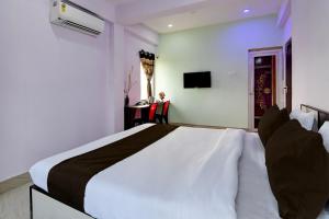 Postel nebo postele na pokoji v ubytování OYO Hotel Soulmate