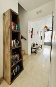 a room with a book shelf filled with books at Las Brisas Estepona in Estepona