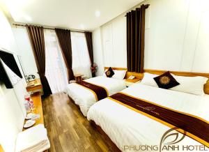Postel nebo postele na pokoji v ubytování Phuong Anh Hotel