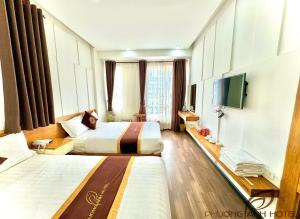 Postel nebo postele na pokoji v ubytování Phuong Anh Hotel