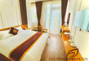 Postel nebo postele na pokoji v ubytování Phuong Anh Hotel