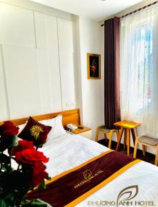 Postel nebo postele na pokoji v ubytování Phuong Anh Hotel