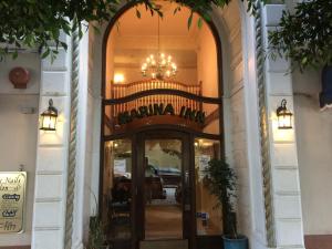 an entrance to a building with a chandelier above the door at Marina Inn in San Francisco