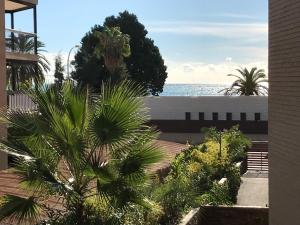a view of the ocean from the balcony of a house at Villa Pepita in Benicàssim