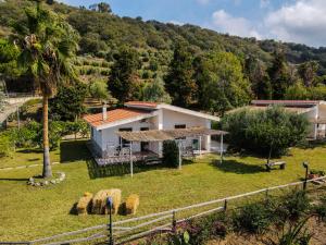a villa with a view of a house at Residence Olimpo in Capo Vaticano
